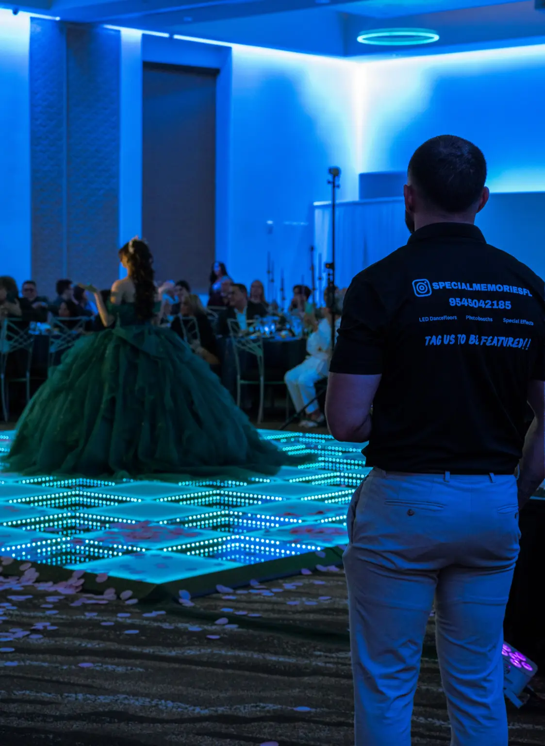 Special Memories FL team member monitoring an active Infinity LED dance floor during a quinceañera