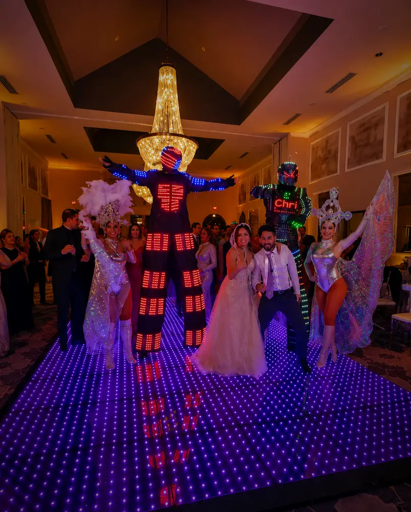 LED stilt robot performing on a wedding dance floor in South Florida