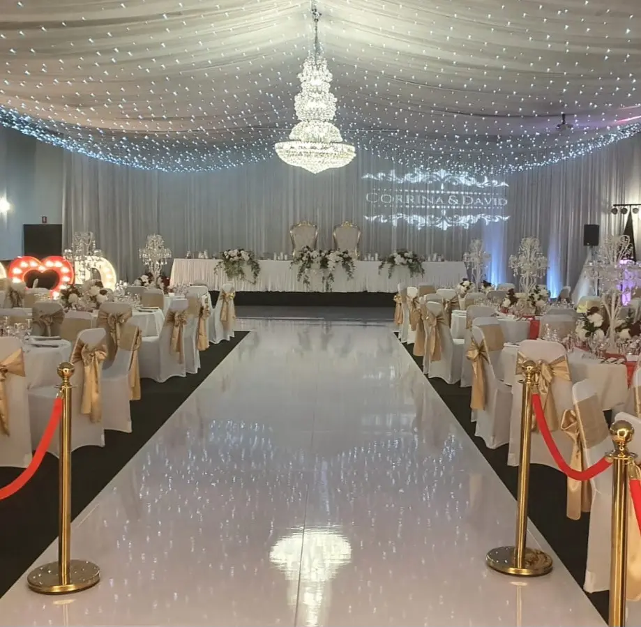 Custom white dance floor with personalized initials for a luxury wedding in South Florida.