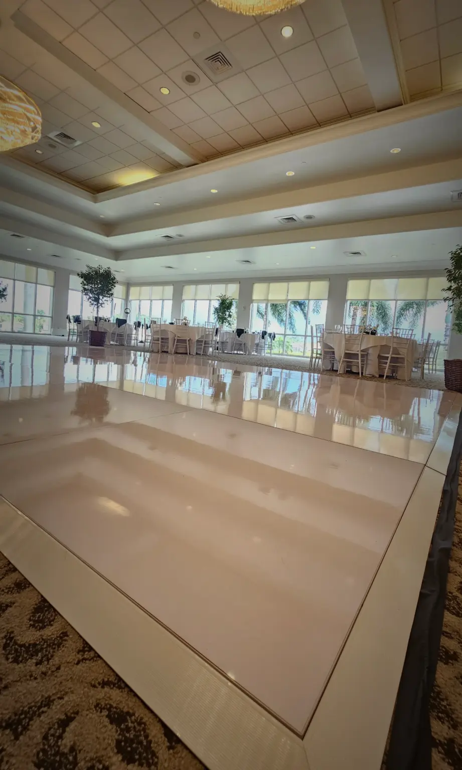 Elegant white dance floor with oversized 4x4 panels installed for a luxury wedding in Fort Lauderdale.