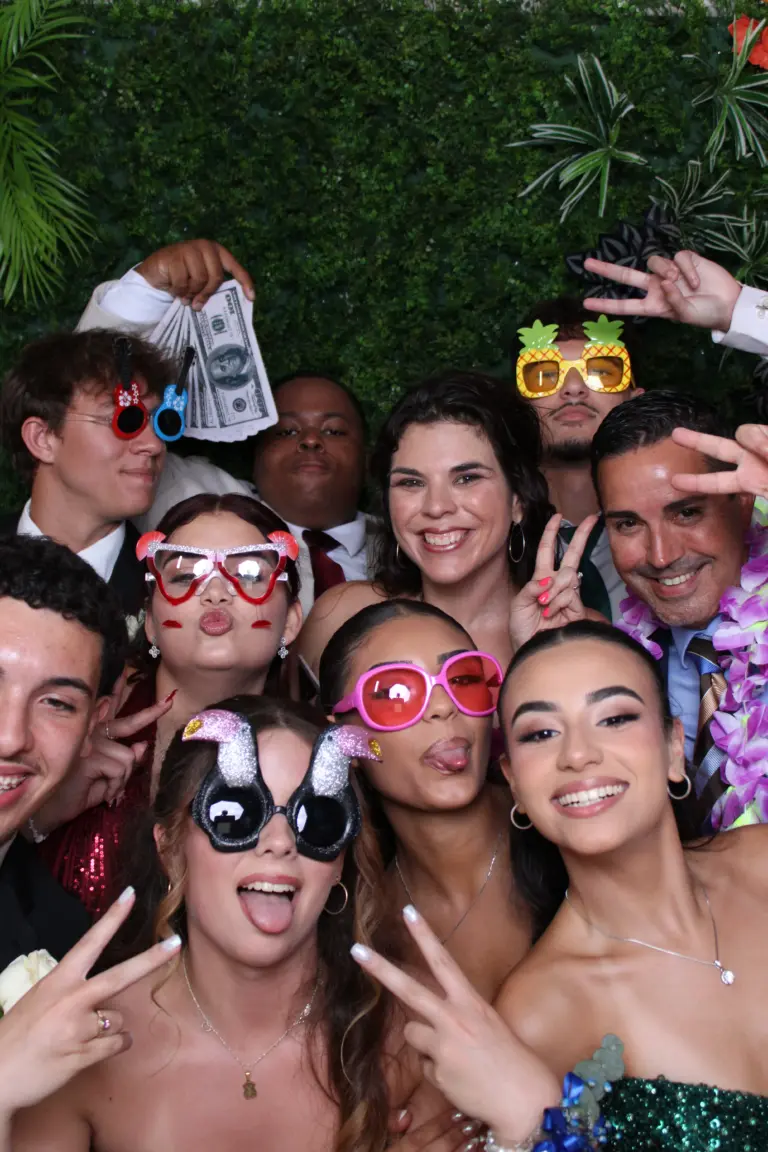 Group of party guests posing together during a celebration in Palm Beach