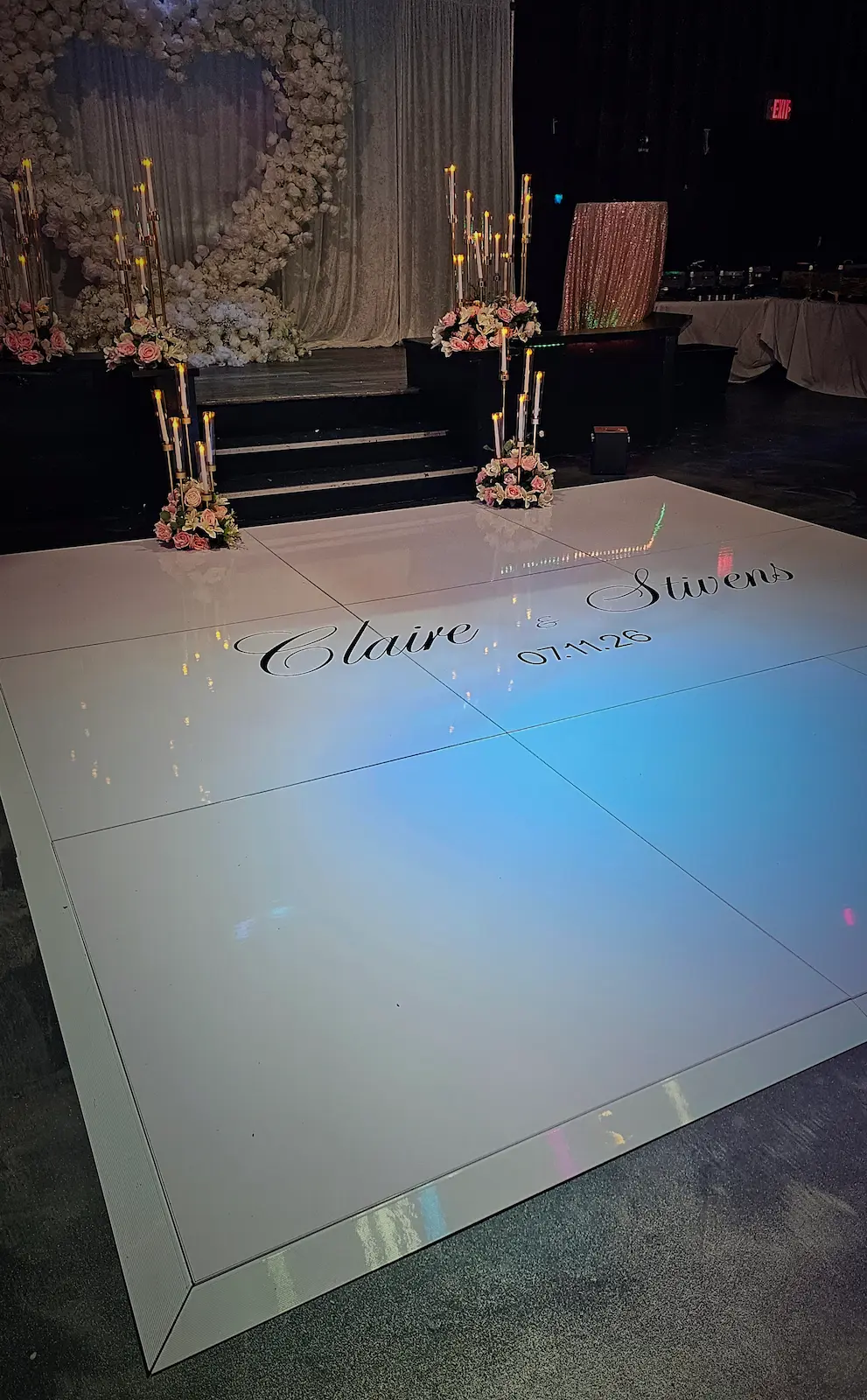 Luxury white dance floor rental for weddings in Boca Raton with custom vinyl design.