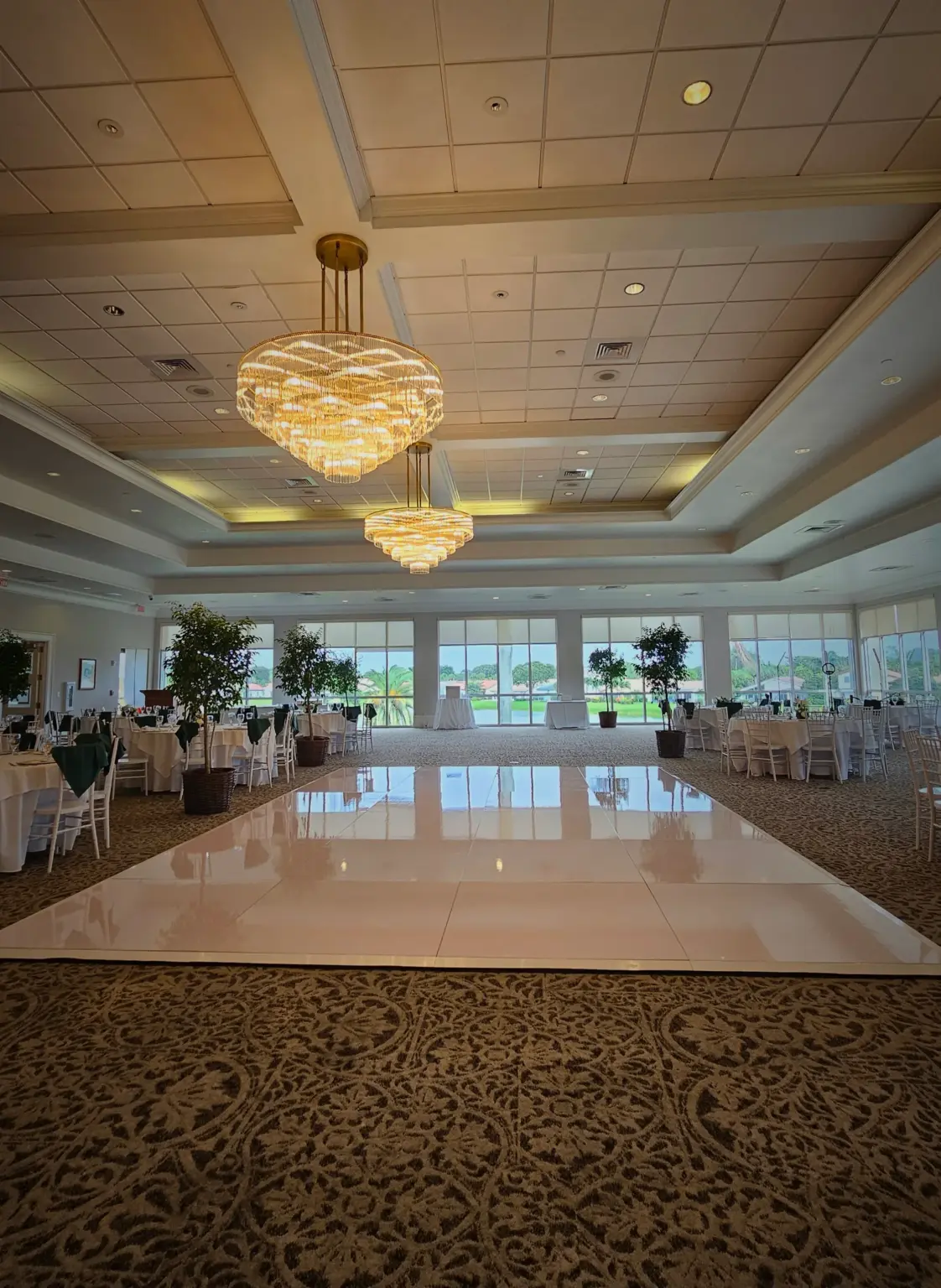 High-gloss white dance floor with custom monogram for a Palm Beach wedding reception.