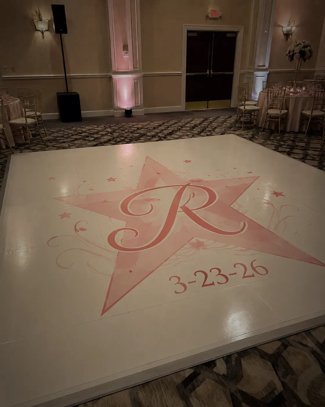 White vinyl wedding dance floor with a large custom monogram installed for a Miami reception