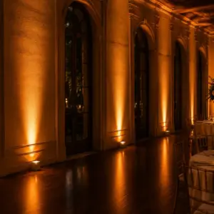 Wireless LED uplighting rental illuminating an elegant event venue in Miami, Florida.