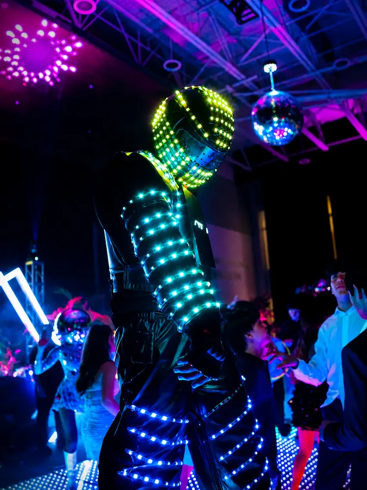 LED robot performer or light-up robot with cold spark effects at a Coral Gables school dance