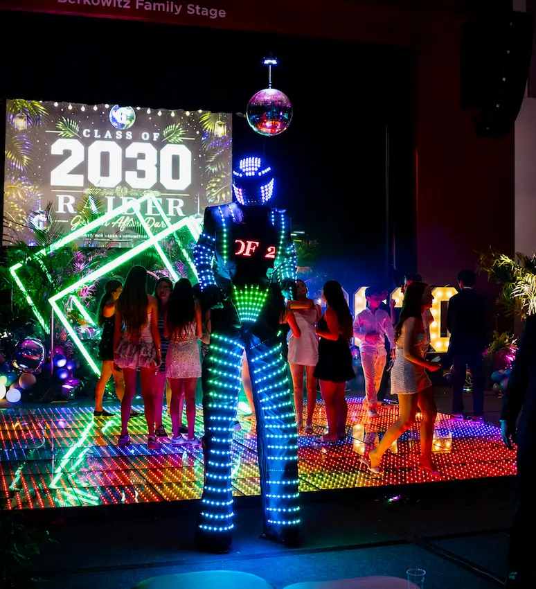 LED Robot on a colorful Pixel LED dance floor at a Coral Gables school event