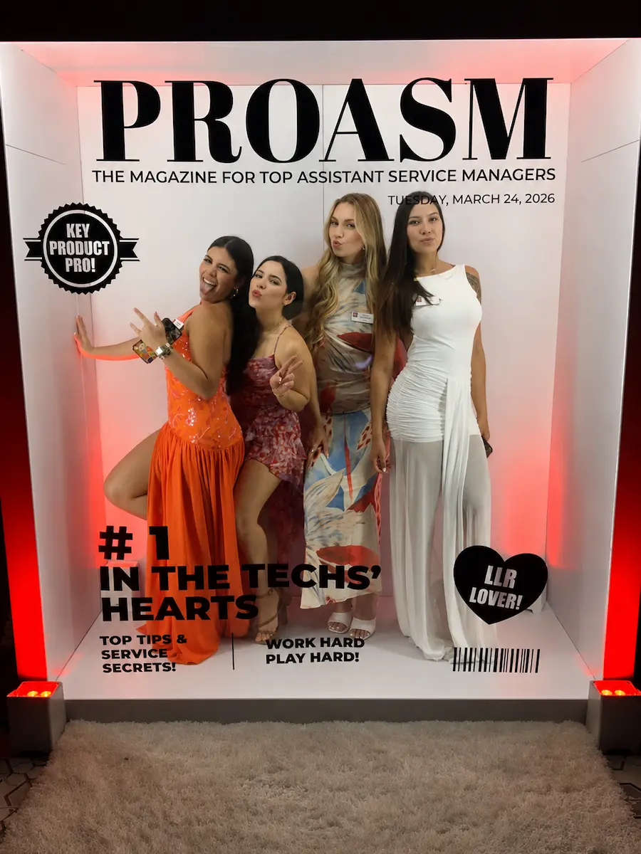 Corporate guests posing inside a Magazine Cover Booth in Fort Lauderdale Florida