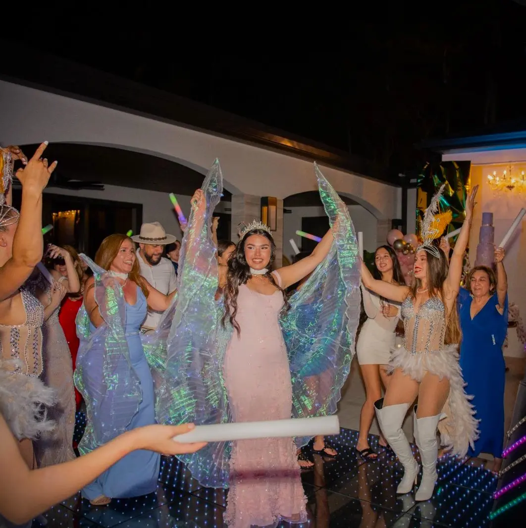 Quinceañera celebrating with professional dancers and LED Robot during Hora Loca on a Pixel LED floor in Kendall Miami