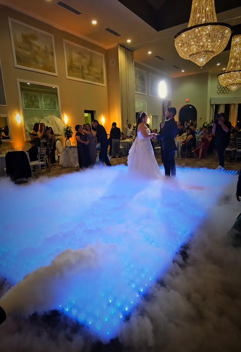 Wide view of Dancing on the Clouds over the Pixel LED dance floor at a Parkland wedding