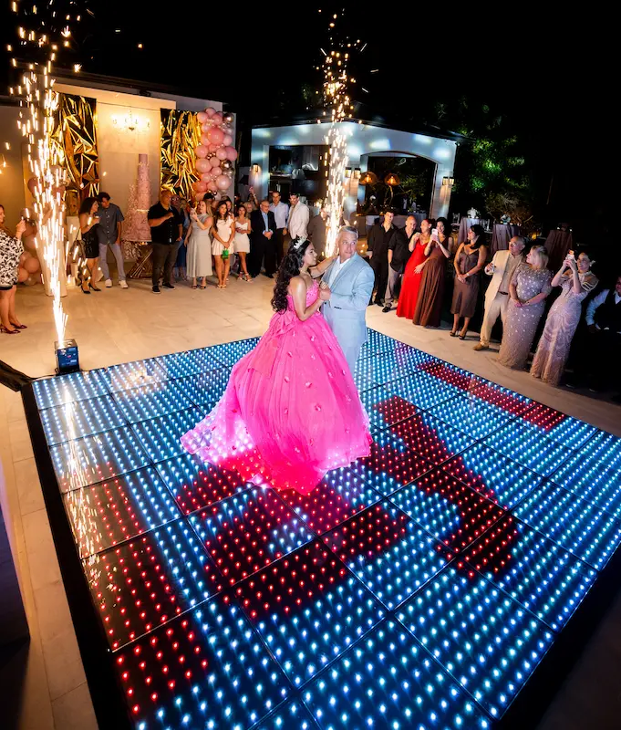 Quinceañera dancing with her father on a Pixel LED dance floor with cold sparklers at a Kendall Miami event