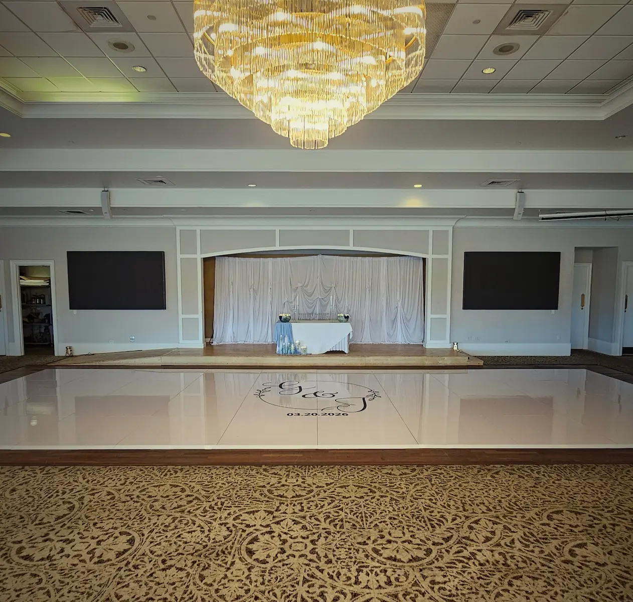 Wide view of a 40 by 20 glossy white wedding dance floor at Indian Spring Country Club in Boynton Beach