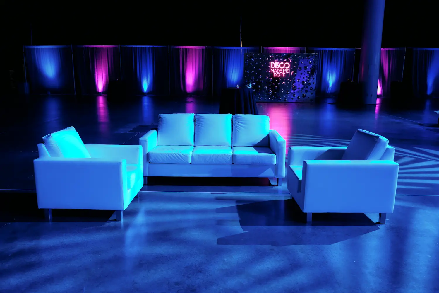 Wireless LED uplighting adding ambient color to a corporate event space