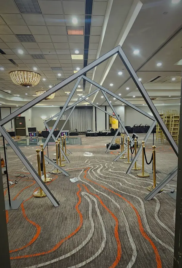 Four geometric LED tunnel frames during setup before a Coral Springs Bat Mitzvah