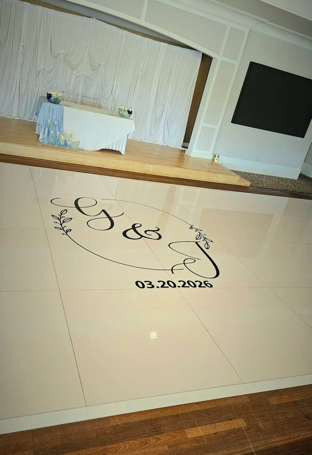 White wedding dance floor with a black monogram at Indian Spring Country Club in Boynton Beach
