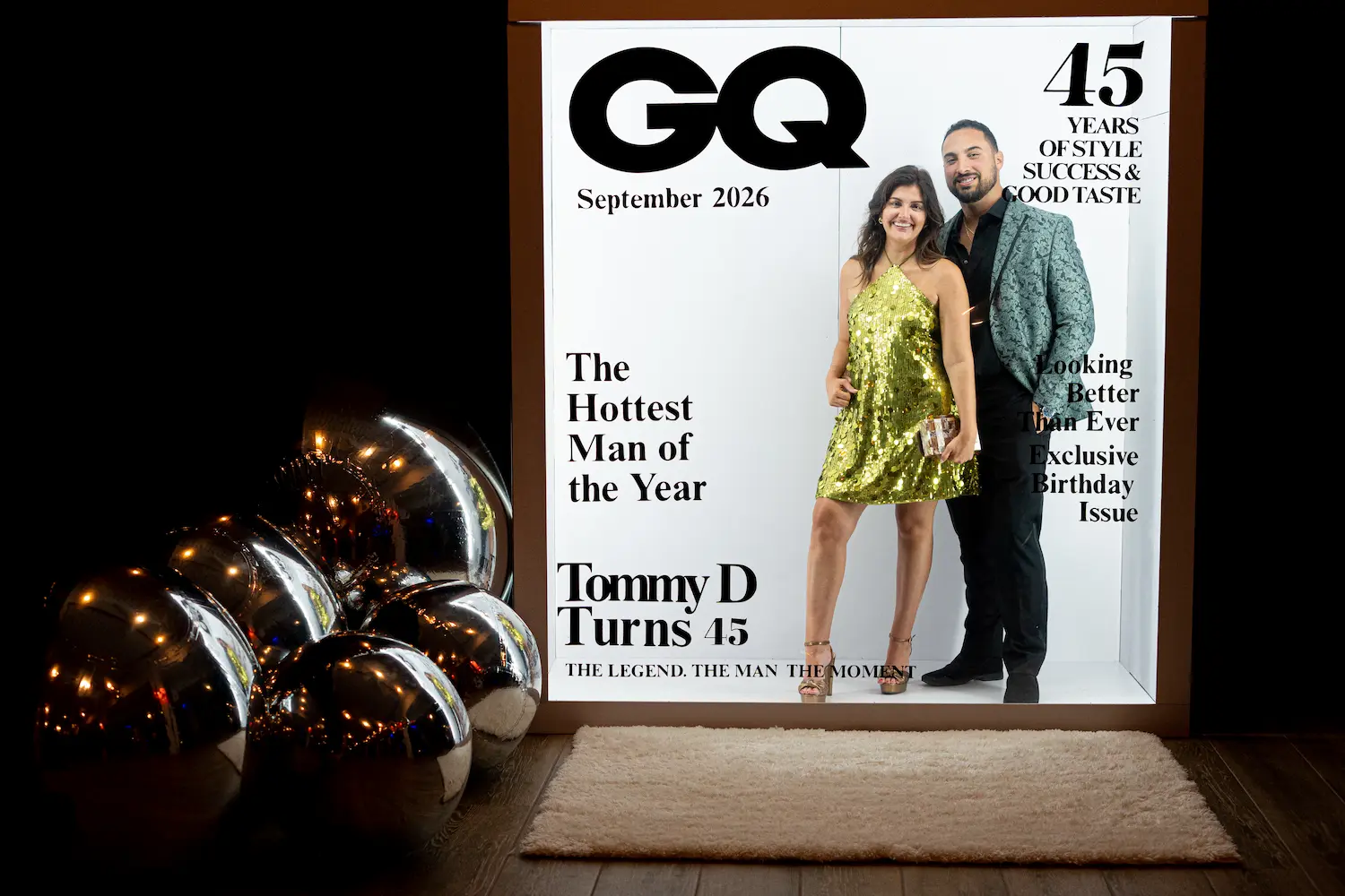 45th birthday party in Boca Raton with a custom Magazine Cover Booth and giant silver mirror balls