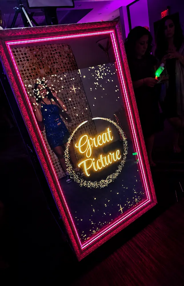 Illuminated Magic Mirror photo booth at a pink Bat Mitzvah celebration