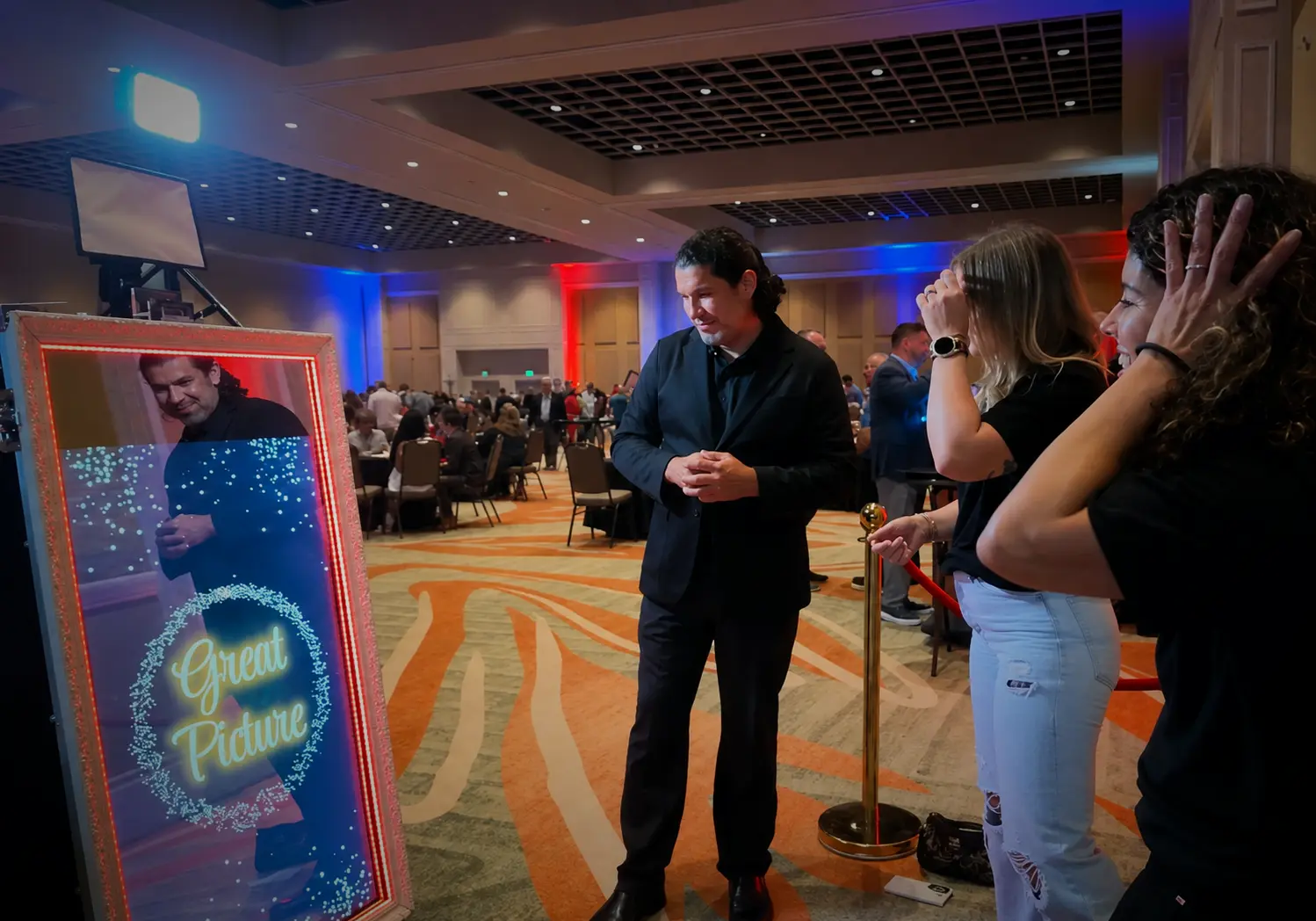 Guests using a Magic Mirror photo booth at the Florida Realtors PAC Jamboree in Orlando