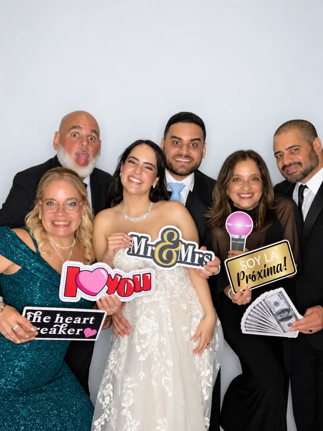 Guests using a photo booth at a Boynton Beach wedding reception