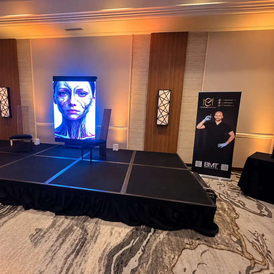 Vertical LED screen at the Top Injector Miami book launch displaying alternate branded visual content on stage