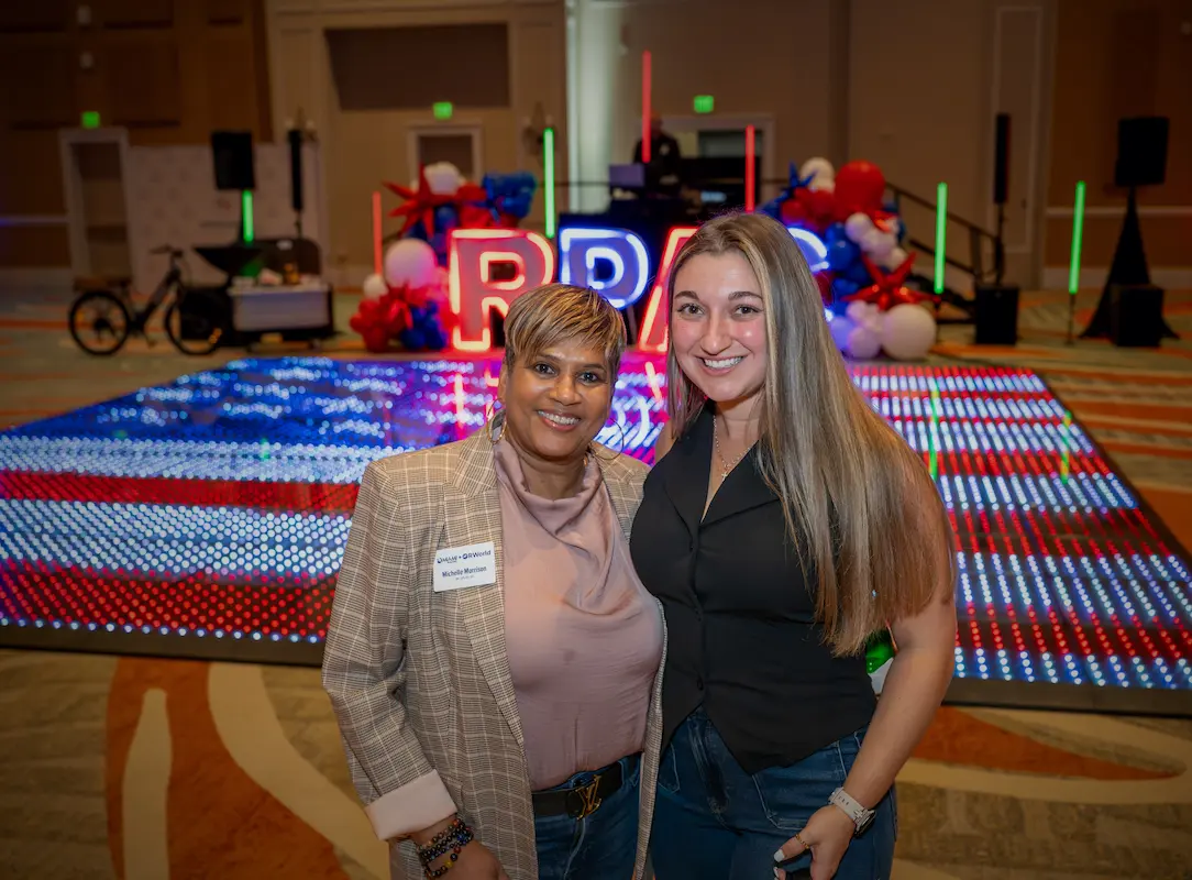 Corporate event guests with a custom U.S. flag Pixel LED dance floor in Orlando
