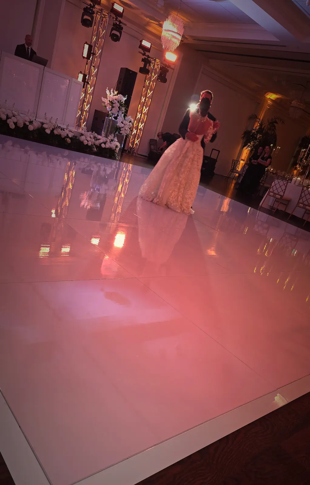 Bride dancing on a glossy 24 by 24 white wedding dance floor at an indoor Jupiter Florida reception