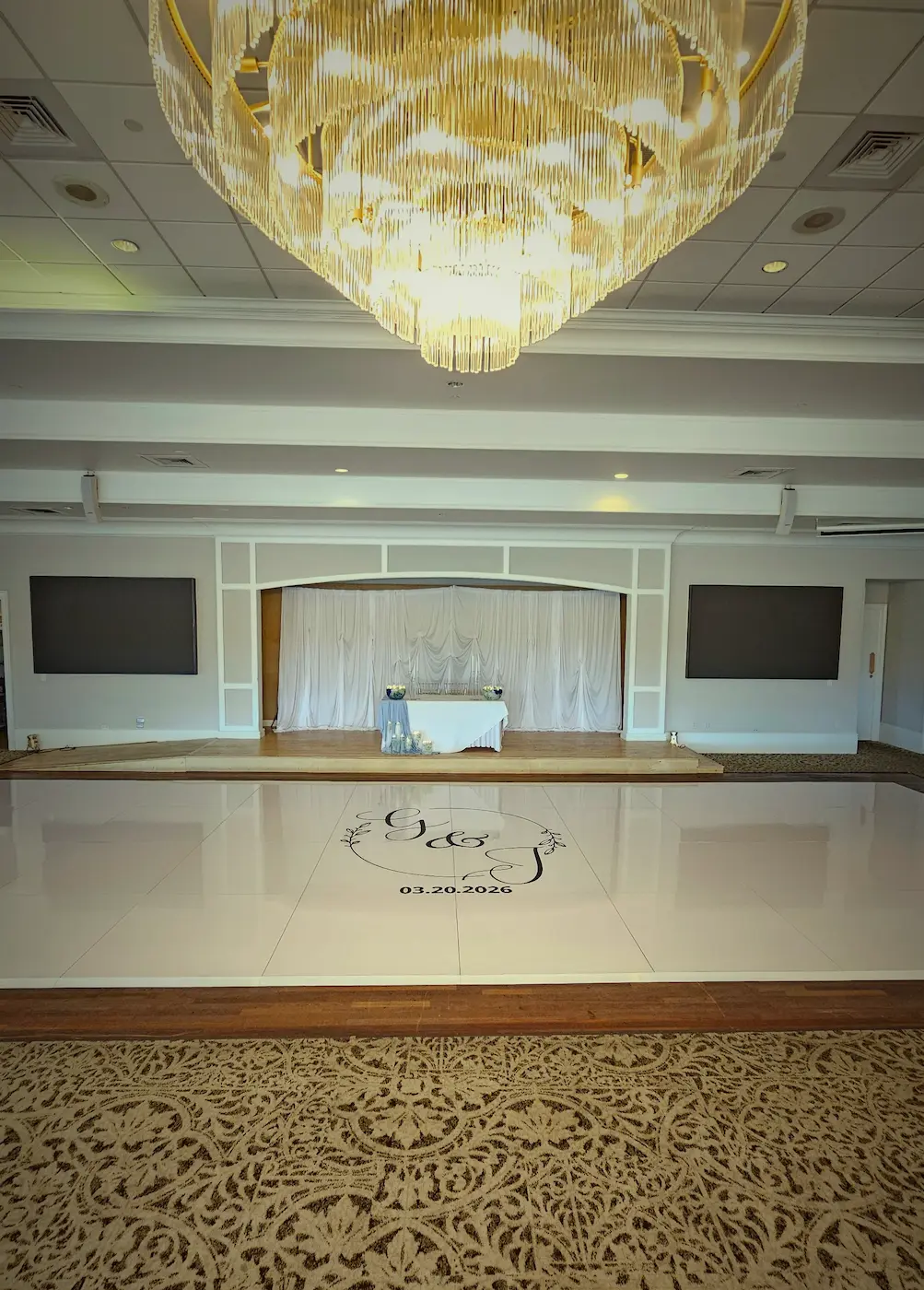 Large glossy white wedding dance floor inside the Indian Spring Country Club ballroom in Boynton Beach