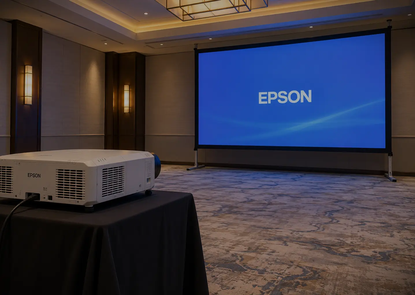 Illustrative hotel meeting-room setup with an Epson projector and projection screen