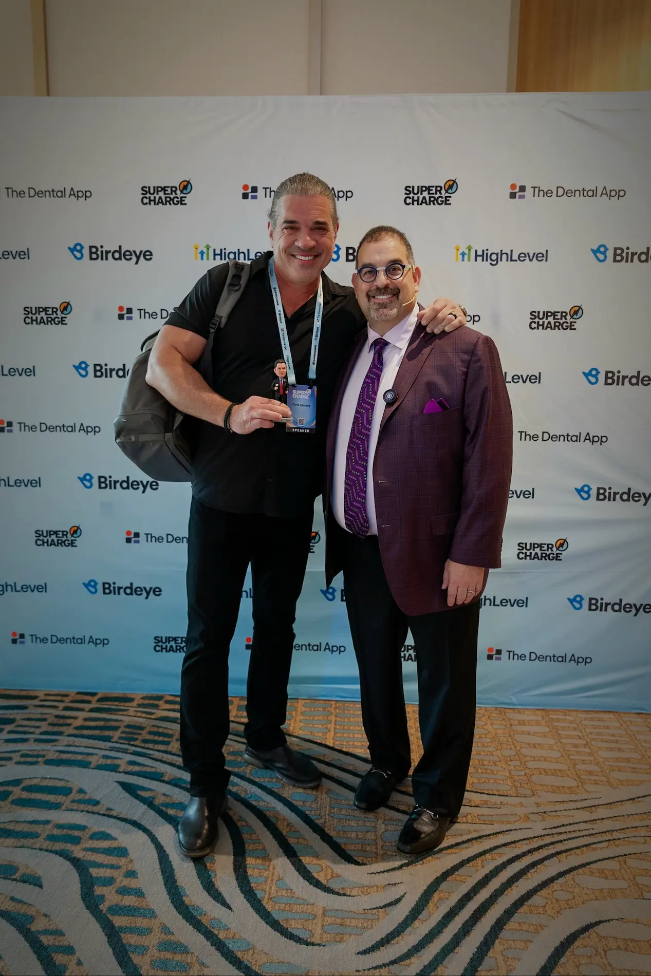Event photo with Dr. Len Tau at Supercharge 2026