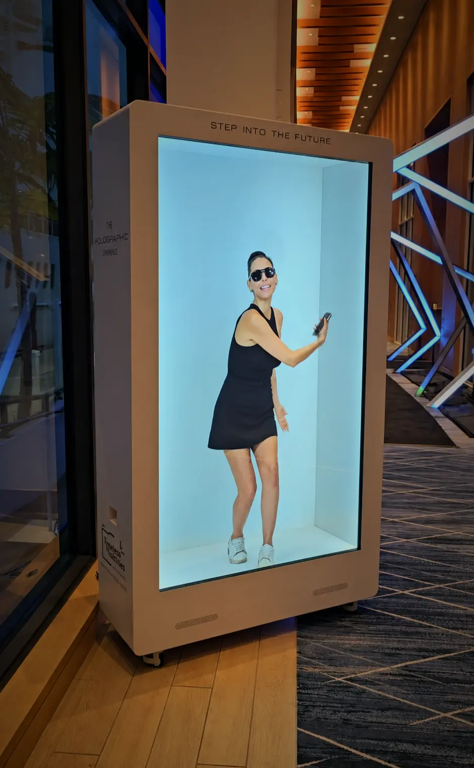 Life-size hologram display featuring a personalized welcome message at a corporate event.