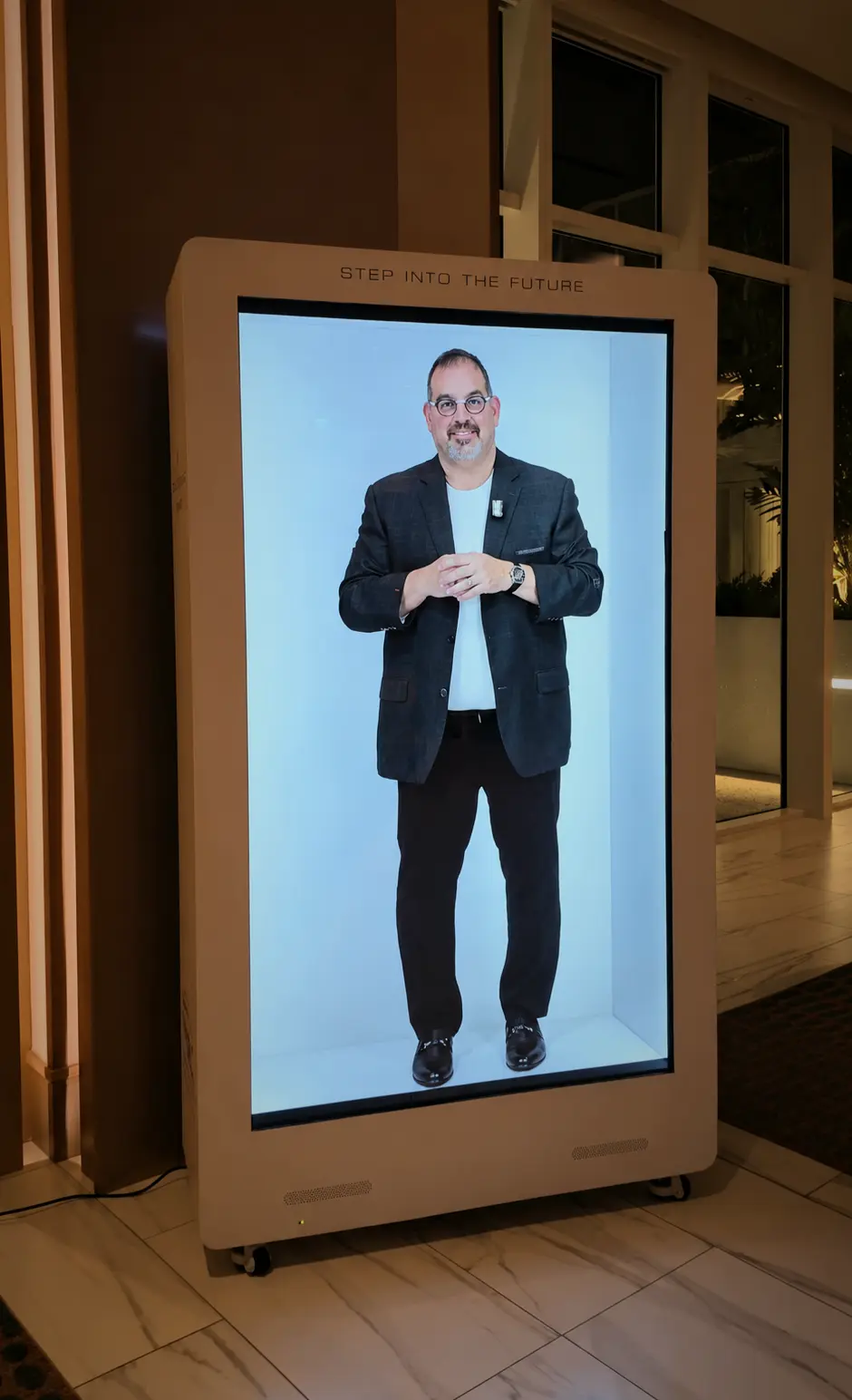 Prerecorded presentation of Dr. Len Tau inside the hologram box at the Fort Lauderdale dental conference