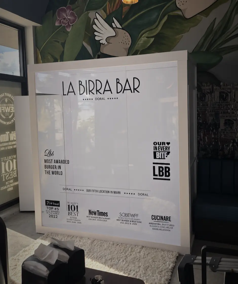 Custom La Birra Bar Magazine Cover Booth installed at the restaurant entrance in Doral